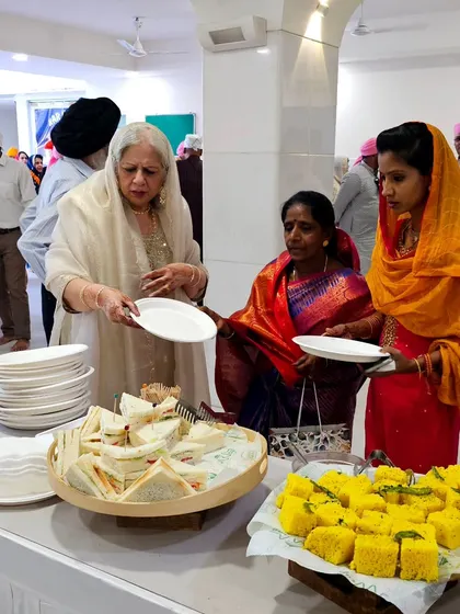 Guests enjoying the breakfast we provided for a wedding baraat. The simple, elegant spread of sandwiches and dhokla was perfect for the occasion.
