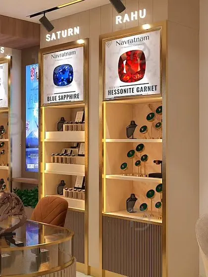 A detailed render of the gemstone display units. Each section is dedicated to a specific stone, like Blue Sapphire and Hessonite Garnet, creating an educational and visually appealing shopping experience.