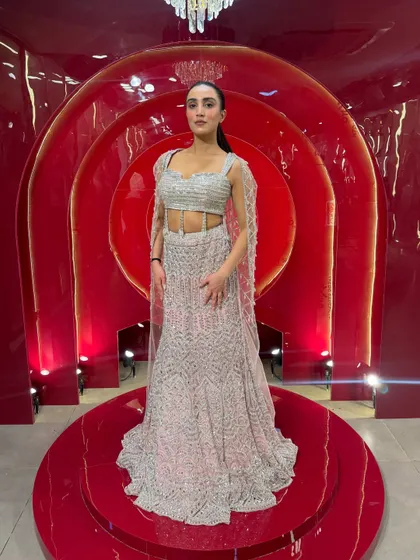 A full-length view of our silver and pink "Indian Barbie" lehenga. The modern silhouette and sparkling details make it a true head-turner.