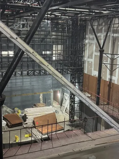 A view from the upper level during the Parker Hall construction, showing the intricate new steel framework being inserted into the historic shell.
