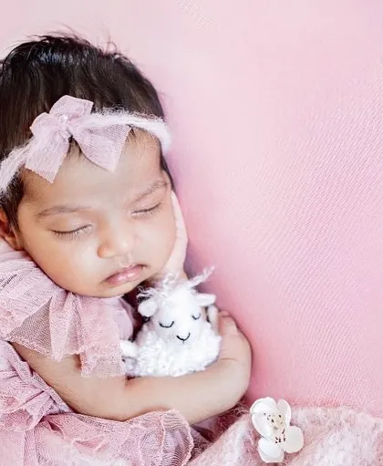 Pretty in pink. This little darling is sleeping so sweetly with her tiny lamb toy. I have a wide selection of outfits and props to match any color scheme you love.