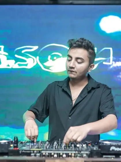 A focused shot of me mixing at Plunge in Pune. The background visuals are an essential part of the atmosphere I create.