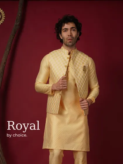 Royal by choice. A yellow patterned Nehru jacket and kurta set, exuding brightness and confidence.