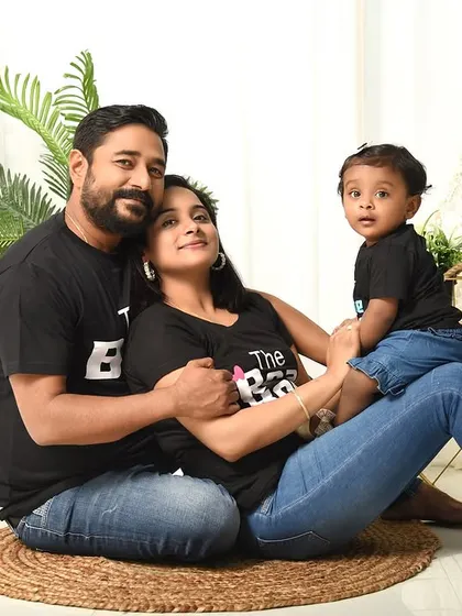 A loving family portrait with a touch of boho style. The casual outfits and relaxed poses create a natural and authentic feel.
