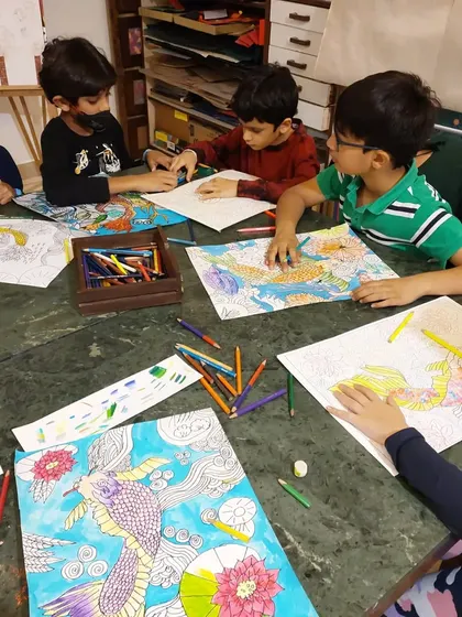 A group of boys chatting and working together on their Japanese art projects. The class is a great social and creative outlet.
