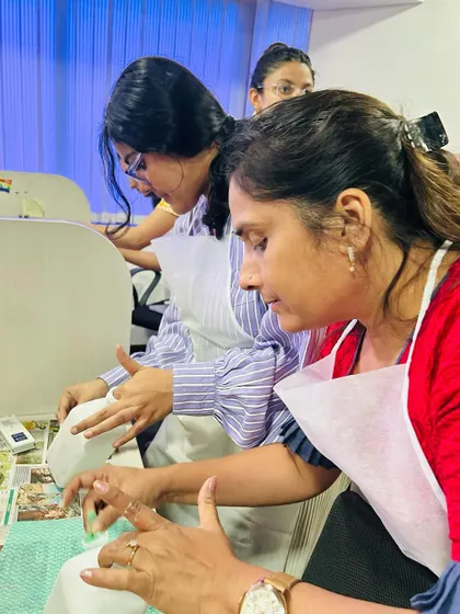 Team members engrossed in their bottle art project. It's a fantastic way to learn a new skill together and create something beautiful.
