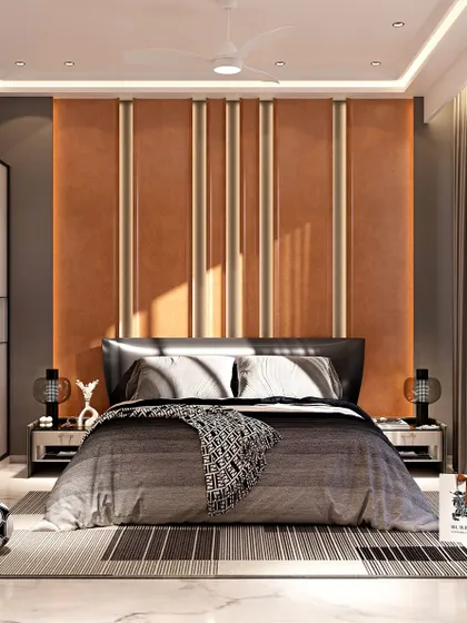 A wider view of the bedroom, showcasing the custom headboard with vertical metallic inlays against a tan backdrop. The room features sliding glass wardrobe doors and direct access to a balcony, blending warmth with modern functionality.