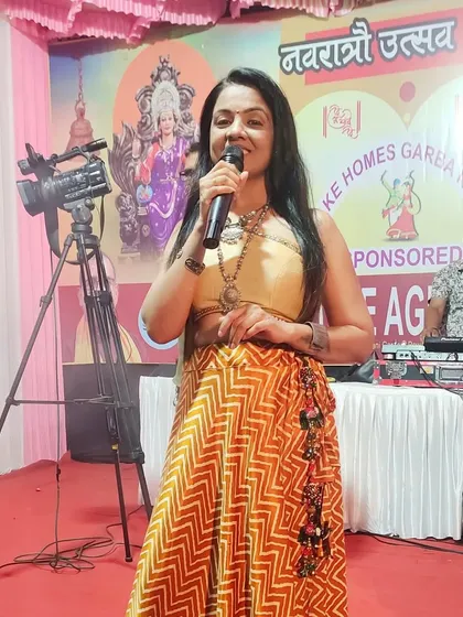 Mic in hand at a Navratri Utsav. From announcing the best dancers to keeping the energy high, I love being the host for these vibrant cultural nights.