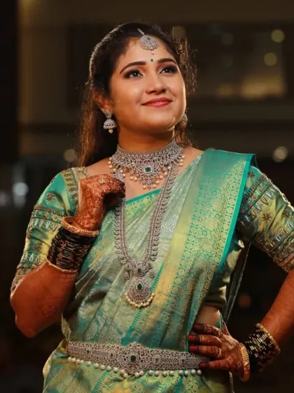 A confident and happy client, posing for the camera. The full CZ set, including the waist belt, creates a complete and glamorous look.