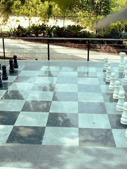 A wide view of the life-sized chessboard, ready for the next grandmasters to begin their game.