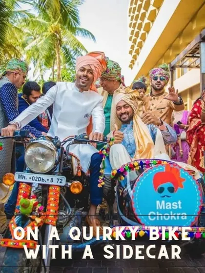 A fun and quirky groom entry idea. The groom arrives on a decorated motorcycle with a sidecar for his best man.