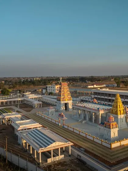 An aerial perspective from the northwest, showing the relationship between the main shrine with its golden vimana and the larger gopuram.
