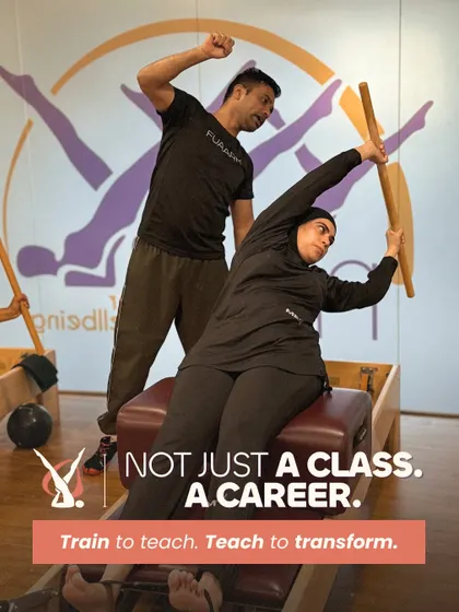 This is more than a class. It is a career. I train you to become a teacher who can truly transform lives. This image shows the hands on mentorship you will receive, guiding you to master the apparatus and the method.