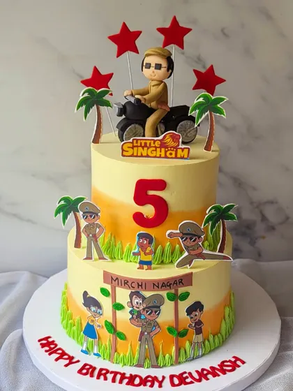 Ala re ala, Little Singham ala! This two-tier cake brings the action of Mirchi Nagar to the party, with Little Singham on his bike and other characters from the show.