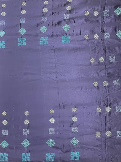 The full view of the contemporary Kasuti saree. The gradient-like arrangement of the motifs in shades of blue and silver creates a sophisticated and unique look.