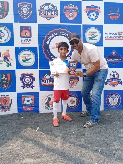 One of our young players receives an award at a Mumbai Football Association event. We provide pathways for our athletes to compete and get recognized in official leagues.