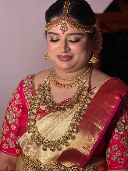 A close-up shot of Aishwarya's muhurtham makeup. You can see the soft shimmer on the eyes and the smooth, skin-like finish of the base, all captured on an iPhone to show the real result.
