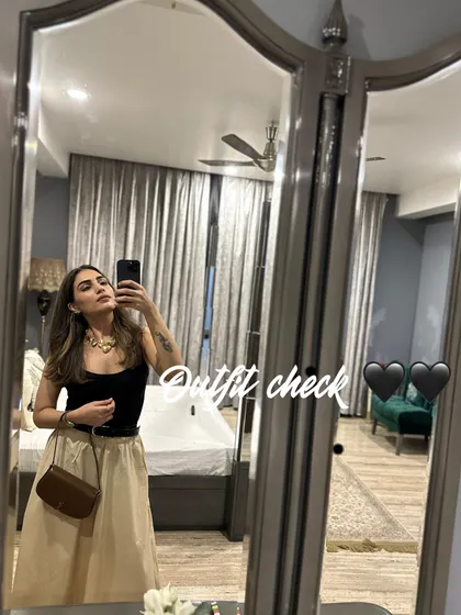 A quick little life haul. An outfit check in a black top and beige skirt.