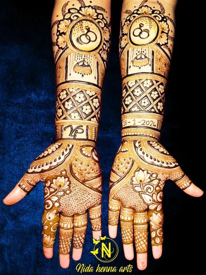 An engagement henna design featuring interlocking rings and the couple's initials. I also included the engagement date, 18-1-2024, to make it extra special.