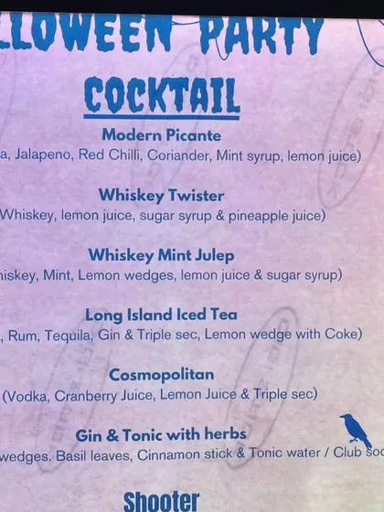 Our custom Halloween cocktail menu, with spooky-themed names and designs to match the party's vibe.