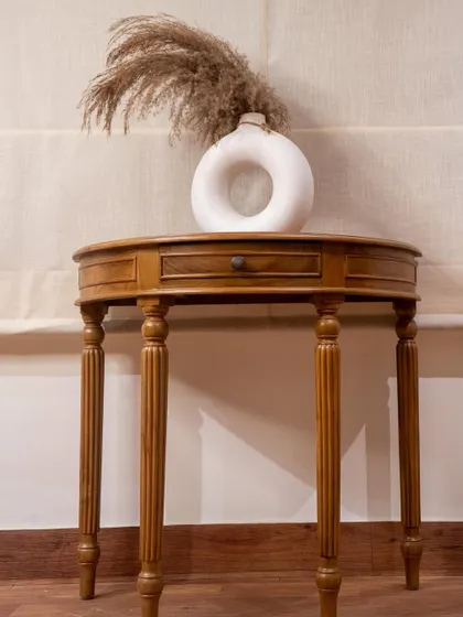 Craftsmanship is in the details. This custom-made teak console table features gracefully turned and carved legs, showing a more classic side of my work. It’s a versatile piece that can serve as a study desk, an entryway table, or a display cabinet.