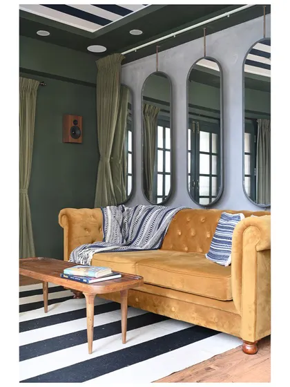 A duplicate of image 149, showing the cozy and eclectic media room.