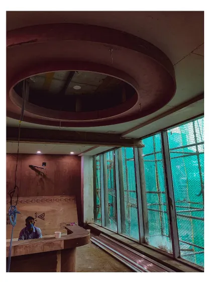 An in-progress shot from a hospital site, showing the installation of a circular stretch ceiling light. This behind-the-scenes view reveals the structural work that underpins our finished designs.
