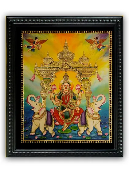 This radiant Tanjore painting of Goddess Lakshmi, the bestower of wealth and prosperity, is a timeless masterpiece. The use of vibrant colors and 22K gold foil makes it a beacon of positivity for any space.
