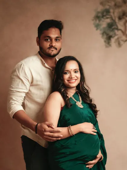 A lovely couple's portrait from a traditional saree session. The way he holds her, and the soft smiles they share, make this a truly heartwarming image.
