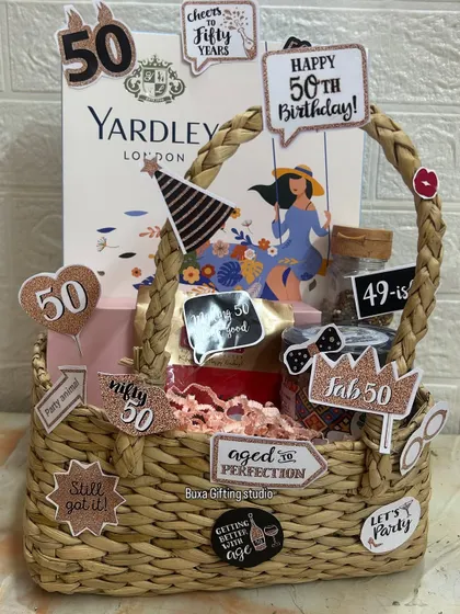 Fifty and fabulous deserves a special celebration. I designed this fun-filled hamper with cheeky "aged to perfection" cutouts, indulgent mukhwas, a glam set from Enn Beauty, and a classic Yardley London gift set to honor this incredible milestone.
