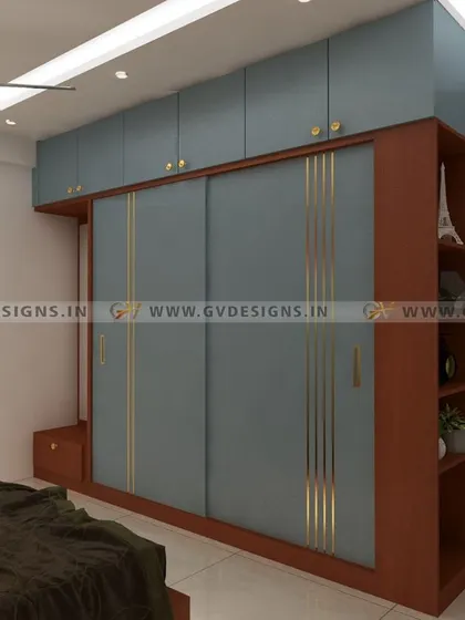 This wardrobe design in a serene grayish-blue hue features elegant T-bending metal inlay details on the sliding doors. A cleverly incorporated side display unit provides the perfect showcase for accessories or books.