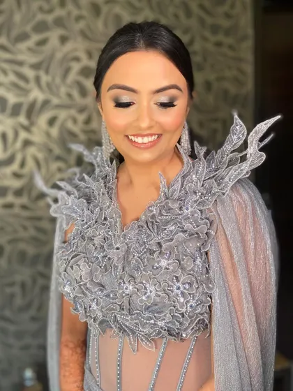 Bansi's reception look was all about confidence and high fashion. The makeup is glamorous and modern.