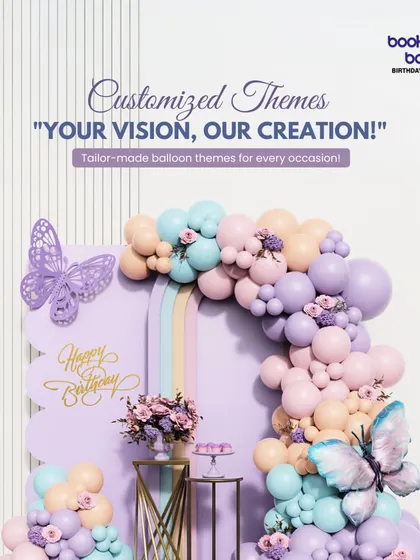 This image showcases our ability to create custom themes based on your vision. The pastel butterfly theme was tailor-made, featuring a beautiful balloon arrangement, delicate butterfly cutouts, and personalized signage.