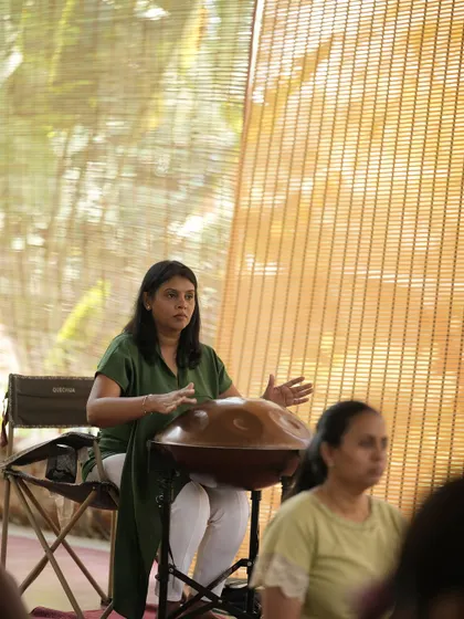 A student practicing the handpan during the retreat.