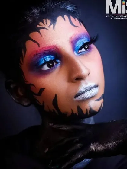 An impressive editorial look created by one of my talented students, featuring bold body art and vibrant, blended eyeshadow. This is the level of skill I cultivate at my school.