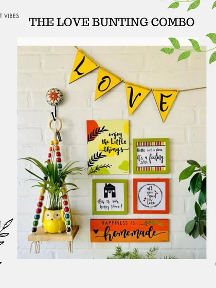 Our 'Love Bunting Combo' is a charming wall decor set that includes a 'LOVE' bunting, hand-doodled wooden planks, colorful glass frames, and a macrame plant hanger with a ceramic owl planter.