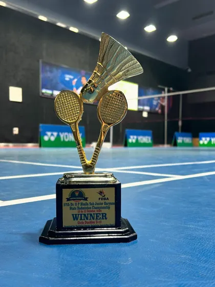 The ultimate prize. This winner's trophy from the Haryana State Badminton Championship is a symbol of the excellence we strive for.