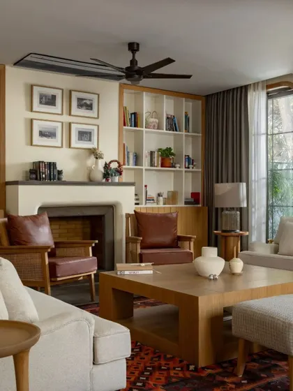 This living room from the House of Continuity shows our passion for restorative architecture. By reconfiguring the layout and enlarging the windows, we transformed an existing structure into a warm, inviting home that honors its past while embracing modern living.