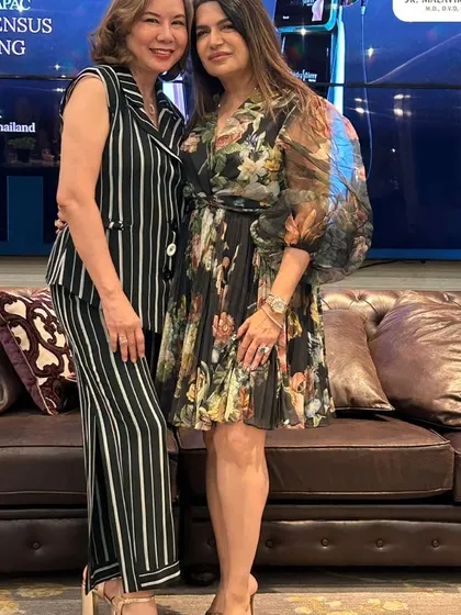 Networking with an international colleague at the APAC 2025 Consensus Meeting. These connections are invaluable for fostering a global community of aesthetic experts.