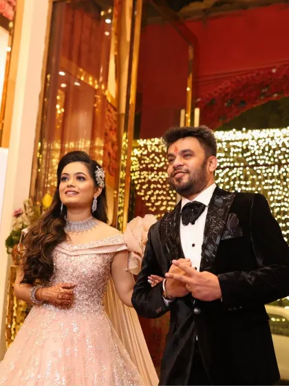 A candid shot of the couple. The bride's makeup is subtle and radiant, allowing her natural happiness to shine through.
