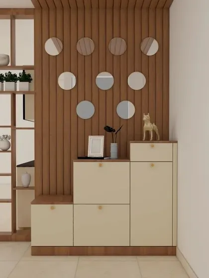 This unit combines a stepped shoe cabinet with a decorative wooden partition featuring circular mirror inlays. It's a creative way to divide space while adding storage and style.