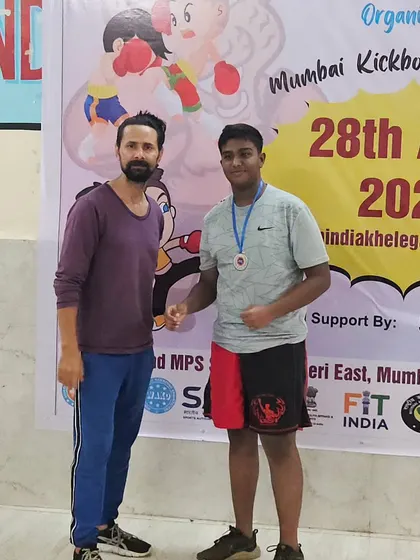 Another one of our dedicated students with his well-earned medal at the district kickboxing championship. Every participant fought well and made us proud.
