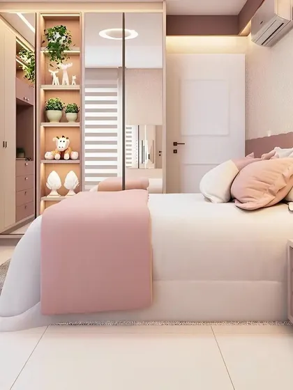 This soft and feminine bedroom design uses shades of pink and cream to create a warm and inviting atmosphere. The mirrored wardrobe with integrated shelving provides both storage and a place to display personal items.