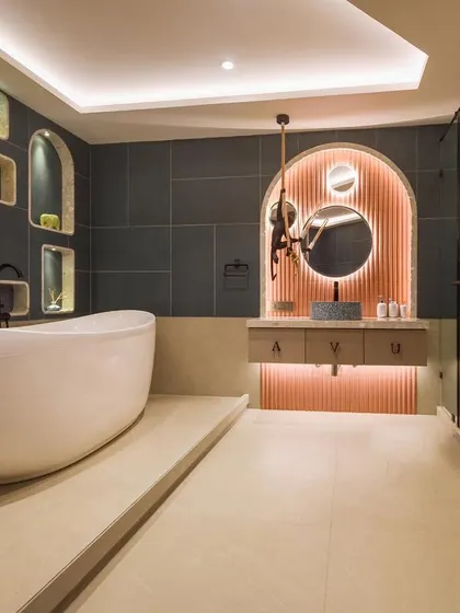 The 'before and after' of the bubble-inspired kids' bathroom. The transformation shows how we created a fun yet stylish space with a new layout, custom niches, and modern fixtures.