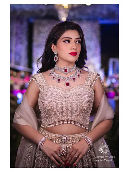 Mahima looked absolutely gorgeous for her engagement. The makeup features a classic red lip and defined eyes, creating a bold yet elegant look that stands out against her beautiful beige lehenga.