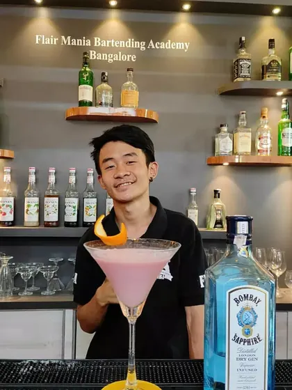 Presenting a beautiful pink gin cocktail. Our team is trained to create drinks that look as good as they taste.