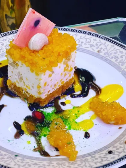A beautifully plated fusion cheesecake, showcasing the vibrant colors and artistic touches I bring to my dessert creations. Each plate is a canvas, designed to be as visually appealing as it is delicious.