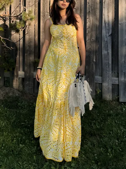 A full shot of the Jardinvue dress, showing off its length and flowy silhouette.