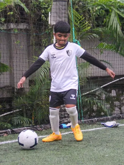 A player prepares to take a shot, demonstrating the focus and preparation that goes into every action on the field.