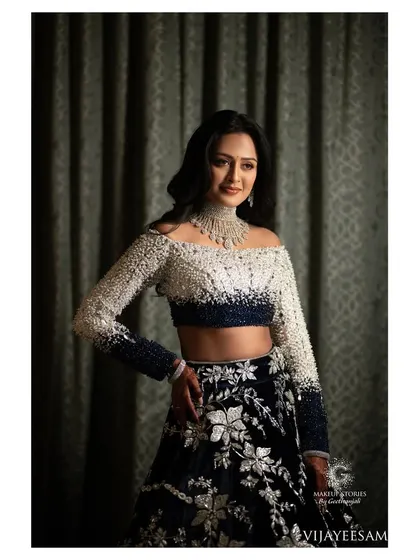 My radiant bride Ashitha for her reception. She looks stunning in a Manish Malhotra creation, with makeup that is both glamorous and sophisticated to match.